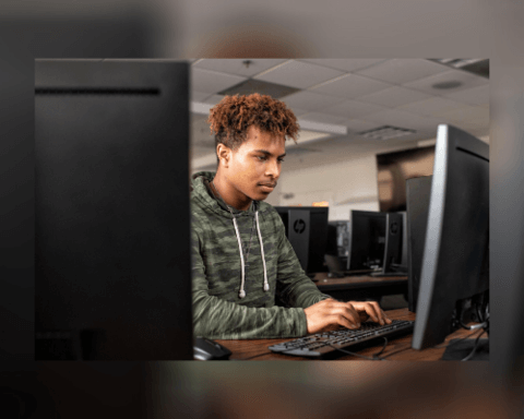 student working on desktop computer